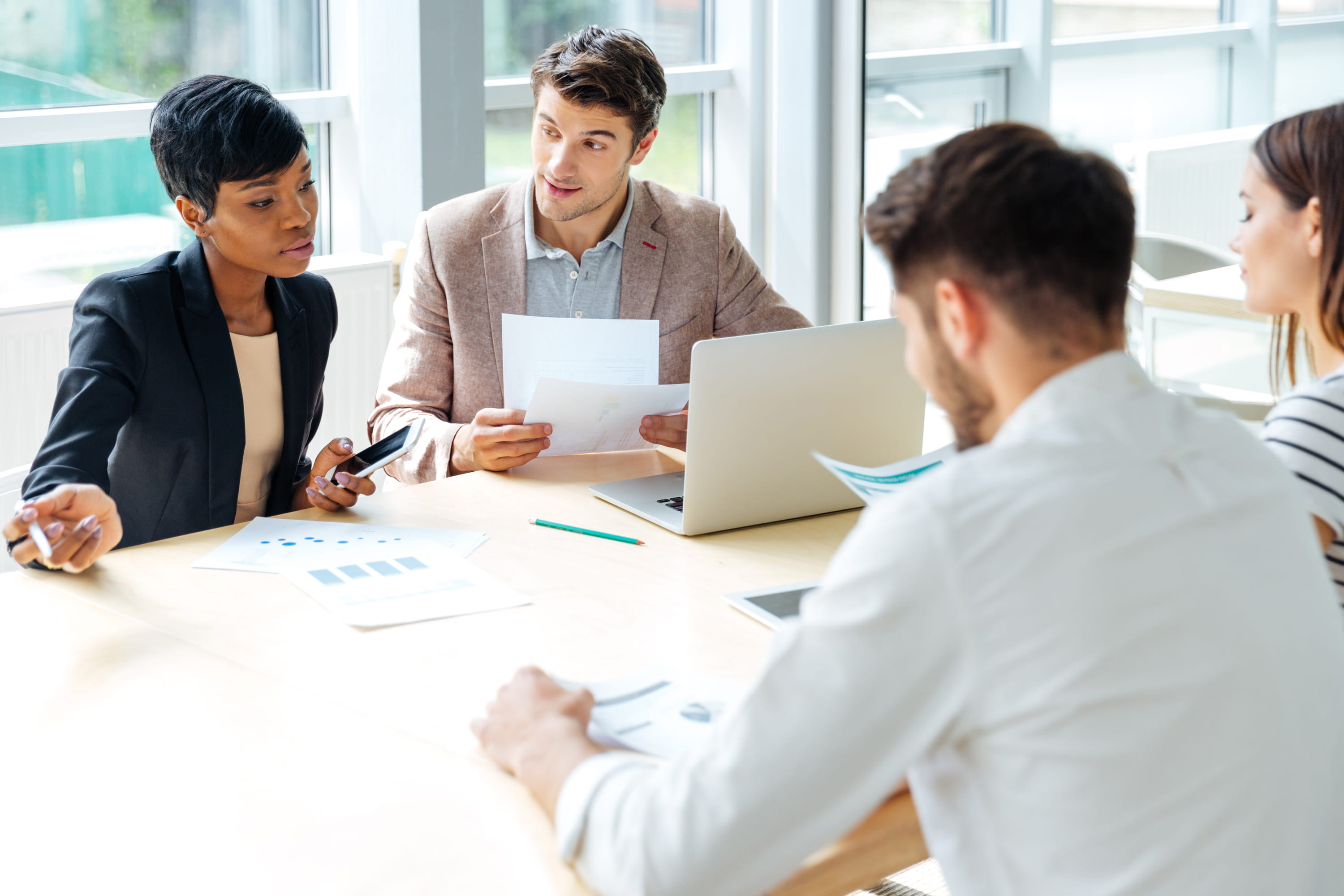People around a table having a discussion