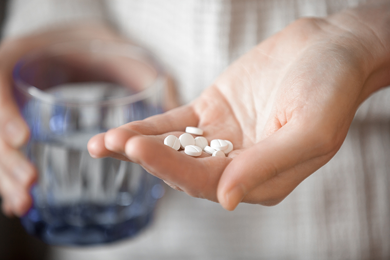 Pill in palm of hand