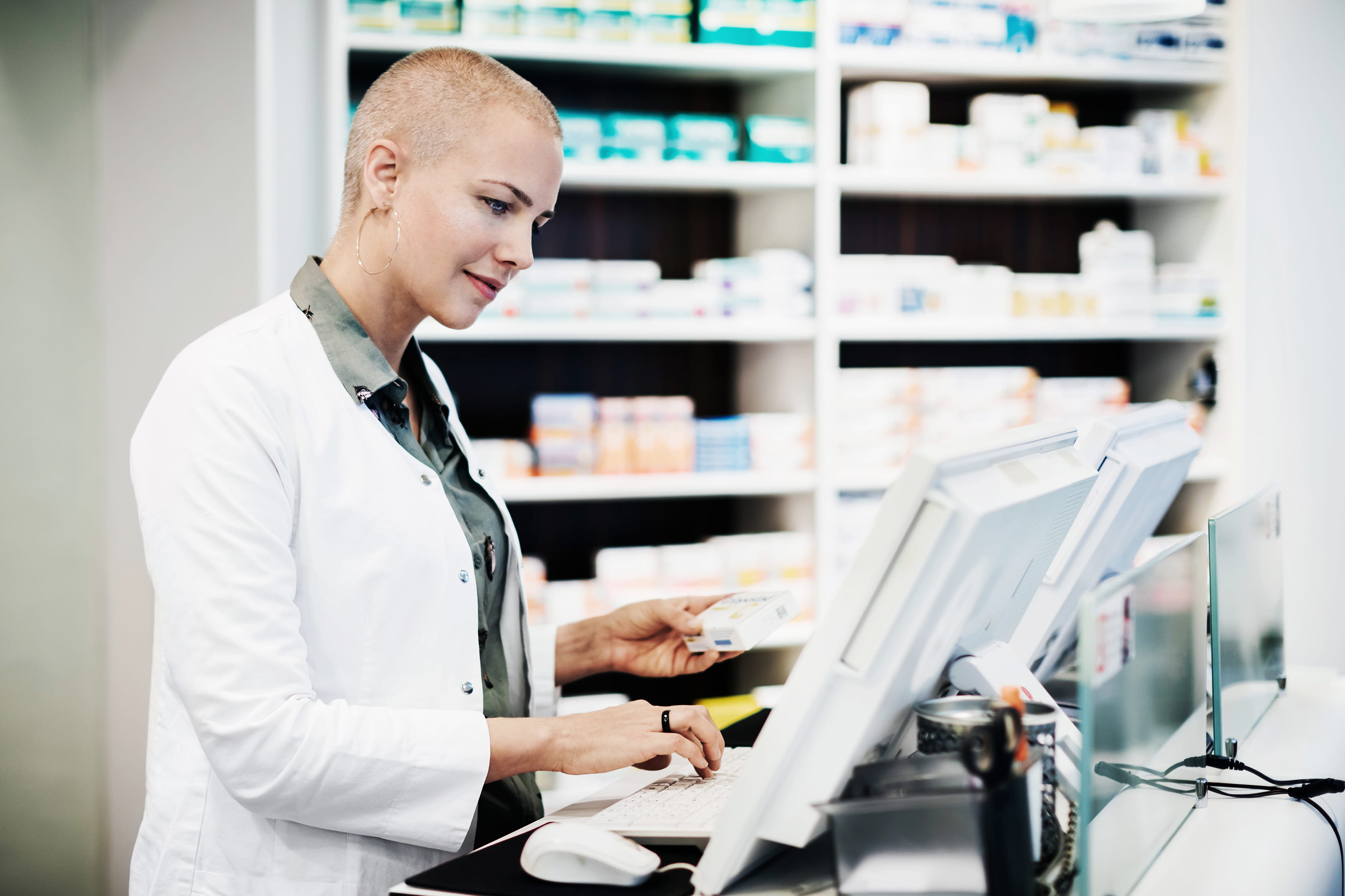 pharmacist looking at monitor