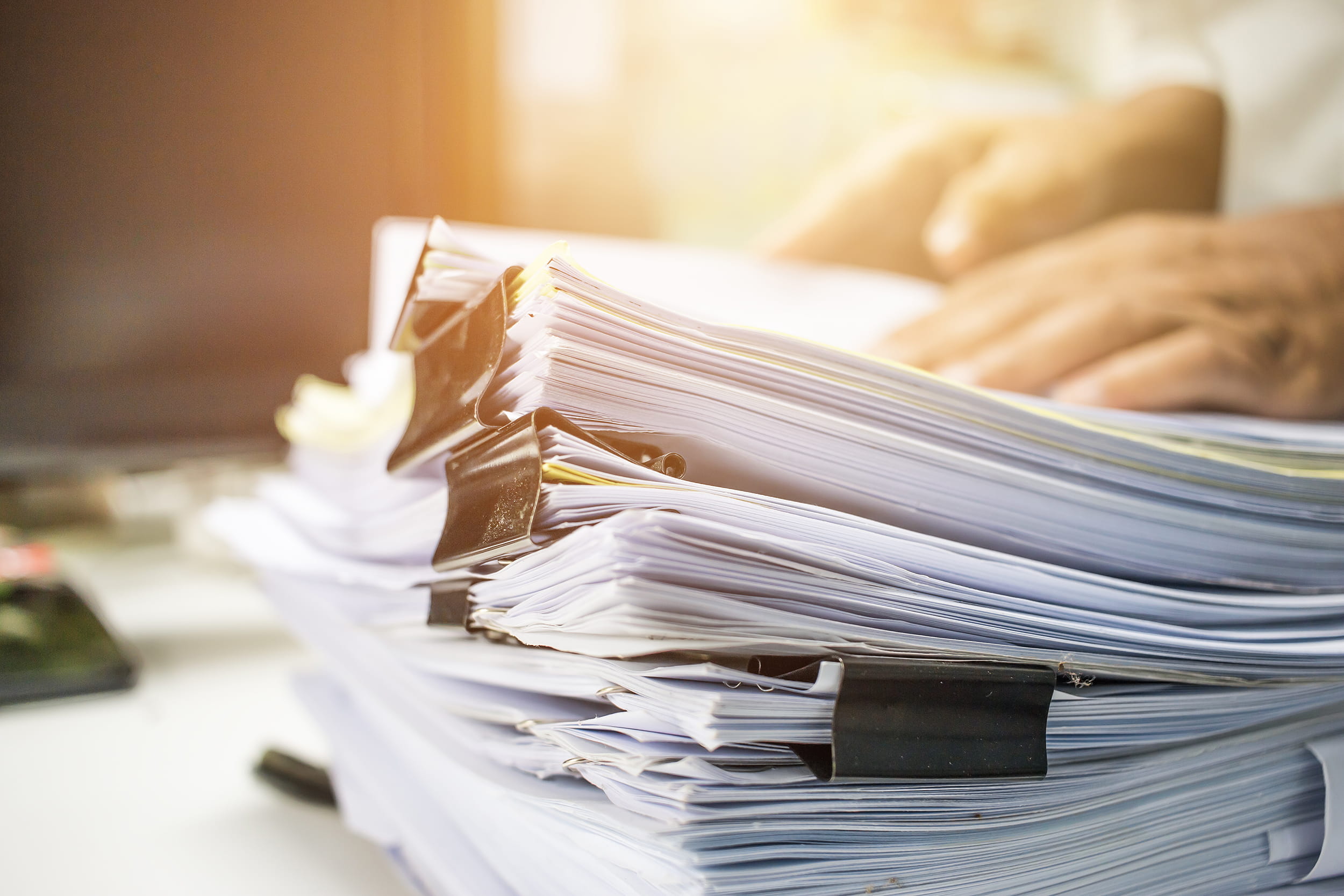 stack of binded papers